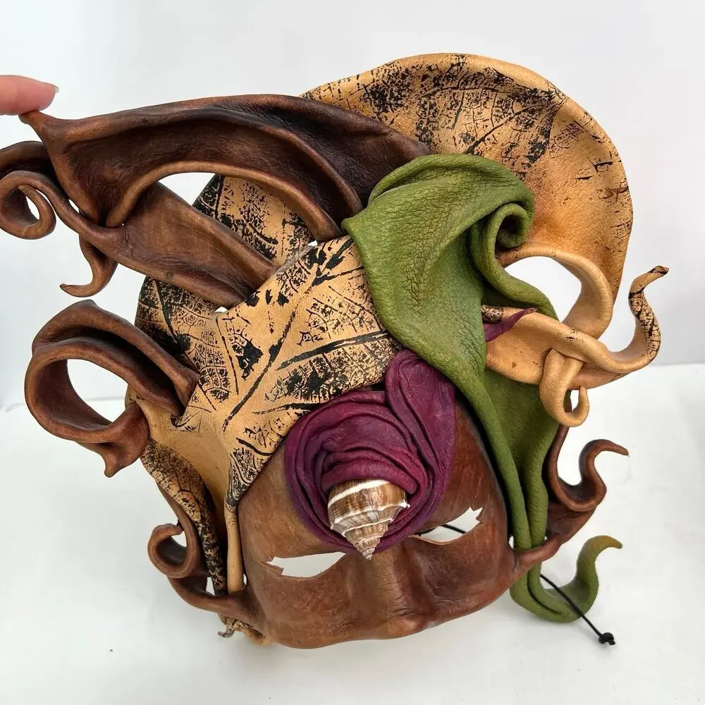Vintage handcrafted leather masquerade mask with shell
